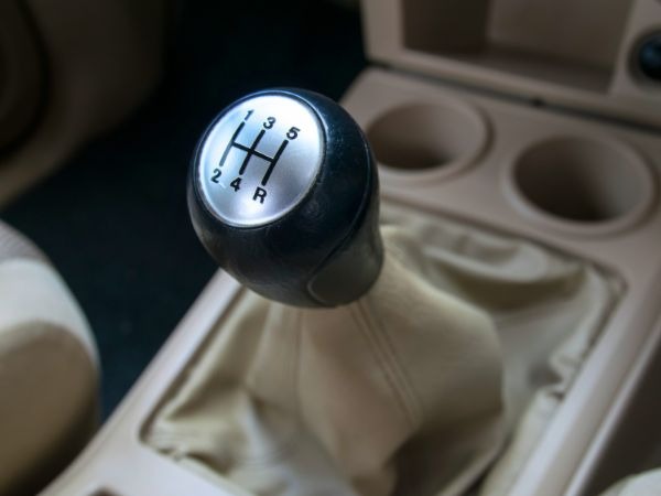 Manual transmission gear stick 5-speed pattern Kenya car rental showing clutch-required stick shift for experienced drivers